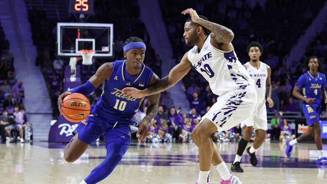 Nov 17, 2025; Manhattan, Kansas, USA; Tulsa Golden Hurricane guard Tylen Riley (10) is guarded by Kansas State Wildcats guard David Castillo (10) during the second half at Bramlage Coliseum. Mandatory Credit: Scott Sewell-Imagn Images