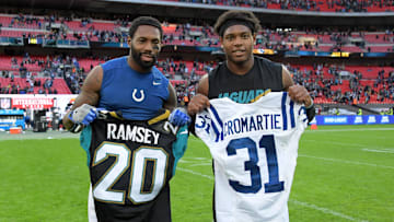 Oct 2, 2016; London, United Kingdom; Indianapolis Colts cornerback Antonio Cromartie (left) and Jacksonville Jaguars cornerback Jalen Ramsey pose after exchanging jerseys after game 15 of the NFL International Series at Wembley Stadium. The Jaguars defeated the Colts 30-27. Mandatory Credit: Kirby Lee-Imagn Images