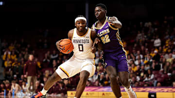 Nov 8, 2025; Minneapolis, Minnesota, USA; Minnesota Golden Gophers guard Chansey Willis Jr. (0) drives towards the basket as Alcorn State Braves guard Mike Jones (22) defends during the first half at Williams Arena. Mandatory Credit: Matt Krohn-Imagn Images