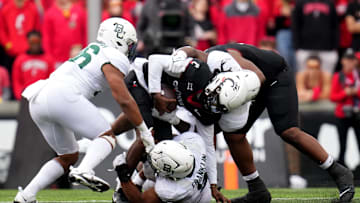 Cincinnati Bearcats quarterback Emory Jones (5) is sacked by Baylor Bears defensive lineman TJ Franklin (9) in the second quarter during a college football game between the Baylor Bears and the Cincinnati Bearcats, Saturday, Oct. 21, 2023, at Nippert Stadium in Cincinnati.