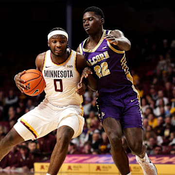 Nov 8, 2025; Minneapolis, Minnesota, USA; Minnesota Golden Gophers guard Chansey Willis Jr. (0) drives towards the basket as Alcorn State Braves guard Mike Jones (22) defends during the first half at Williams Arena. Mandatory Credit: Matt Krohn-Imagn Images