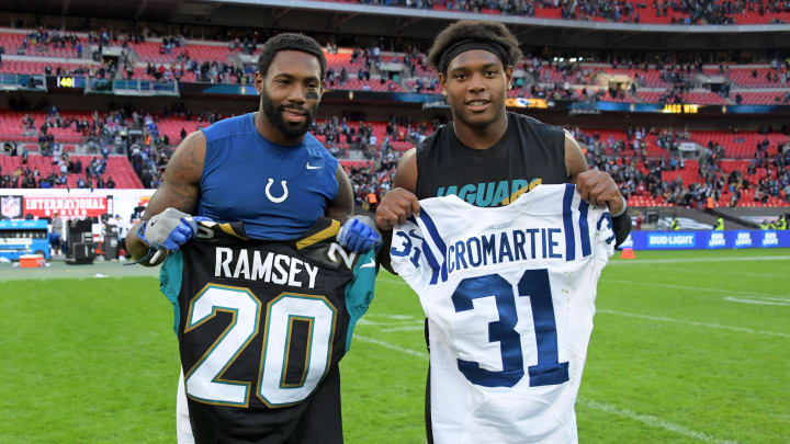 Oct 2, 2016; London, United Kingdom; Indianapolis Colts cornerback Antonio Cromartie (left) and Jacksonville Jaguars cornerback Jalen Ramsey pose after exchanging jerseys after game 15 of the NFL International Series at Wembley Stadium. The Jaguars defeated the Colts 30-27. Mandatory Credit: Kirby Lee-USA TODAY Sports