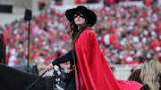 The Texas Tech Red Raiders Masked Rider watches the big screen in the second half during the game against the Oklahoma State Cowboys at Jones AT&T Stadium.