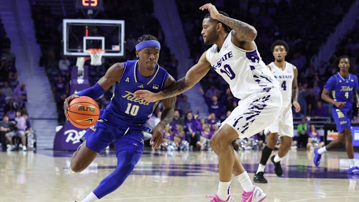 Nov 17, 2025; Manhattan, Kansas, USA; Tulsa Golden Hurricane guard Tylen Riley (10) is guarded by Kansas State Wildcats guard David Castillo (10) during the second half at Bramlage Coliseum. Mandatory Credit: Scott Sewell-Imagn Images