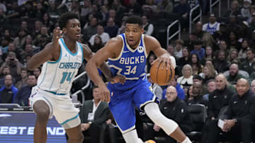 Nov 23, 2024; Milwaukee, Wisconsin, USA;  Milwaukee Bucks forward Giannis Antetokounmpo (34) drives to the basket against Charlotte Hornets forward Moussa Diabate (14) in the first half at Fiserv Forum. Mandatory Credit: Michael McLoone-Imagn Images