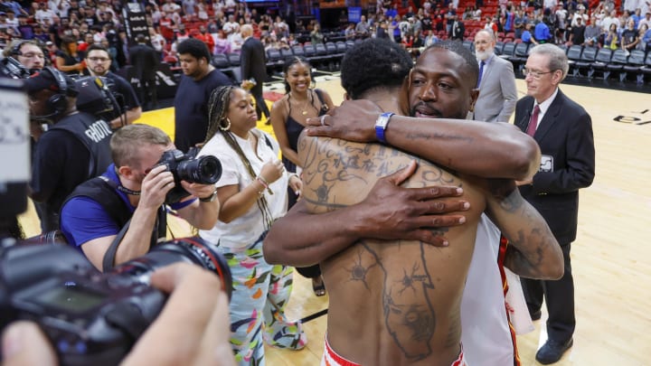 Apr 9, 2023; Miami, Florida, USA; Miami Heat forward Udonis Haslem (40) hugs former Miami Heat player Dwyane Wade after playing his last regular season career game at Kaseya Center. Mandatory Credit: Sam Navarro-USA TODAY Sports