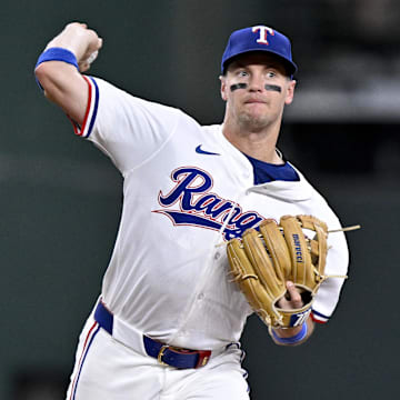 May 1, 2025; Arlington, Texas, USA; Texas Rangers third baseman Josh Jung (6) throws out Athletics catcher Jhonny Pereda (not pictured) during the fifth inning at Globe Life Field. 