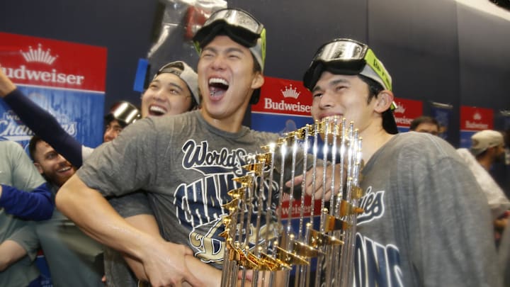 Los Angeles Dodgers two-way player Shohei Ohtani  and pitcher Yoshinobu Yamamoto, and pitcher Roki Sasaki celebrate winning the 2025 World Series.