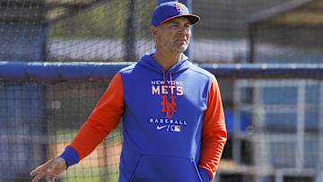 Mar 13, 2022; Port St. Lucie, FL, USA; New York Mets hitting coach Eric Chavez looks on as players take batting practice during spring training. Mandatory Credit: Sam Navarro-Imagn Images