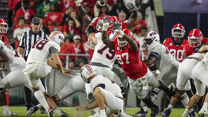 Sep 2, 2023; Athens, Georgia, USA; Georgia Bulldogs defensive lineman Warren Brinson (97) partially blocks a field goal attempt by Tennessee Martin Skyhawks place kicker Aidan Laros (48) during the second half at Sanford Stadium. Mandatory Credit: Dale Zanine-Imagn Images