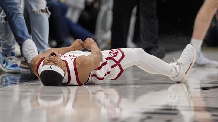 Dec 18, 2024; Charlotte, North Carolina, USA; Oklahoma Sooners guard Jeremiah Fears (0) reacts to hitting the winning shot and being fouled against the Michigan Wolverinesduring the second half at Spectrum Center. Mandatory Credit: Jim Dedmon-Imagn Images