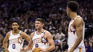 Apr 13, 2025; Sacramento, California, USA;  Phoenix Suns guard Grayson Allen (8) and forward Ryan Dunn (0) react during the second quarter against the Sacramento Kings at Golden 1 Center. Mandatory Credit: John Hefti-Imagn Images