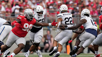Aug 31, 2024; Columbus, OH, USA; Ohio State Buckeyes defensive lineman Kayden McDonald (98) reaches out as Akron Zips quarterback Tahj Bullock (12) mishandles a handoff to running back Charles Kellom (22) during the second half of the NCAA football game at Ohio Stadium. Ohio State won 52-6.