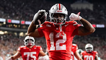 Ohio State Buckeyes running back CJ Donaldson (12) reacts after making it to the endzone during the second half of the NCAA football game against the Ohio State Buckeyes at Ohio Stadium on Sept. 13, 2025. The touchdown was overturned by replay, but Ohio State won 37-9.