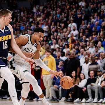 Jan 29, 2024; Denver, Colorado, USA; Milwaukee Bucks forward Giannis Antetokounmpo (34) drives to the basket against Denver Nuggets center Nikola Jokic (15) in the first quarter at Ball Arena. Mandatory Credit: Isaiah J. Downing-Imagn Images