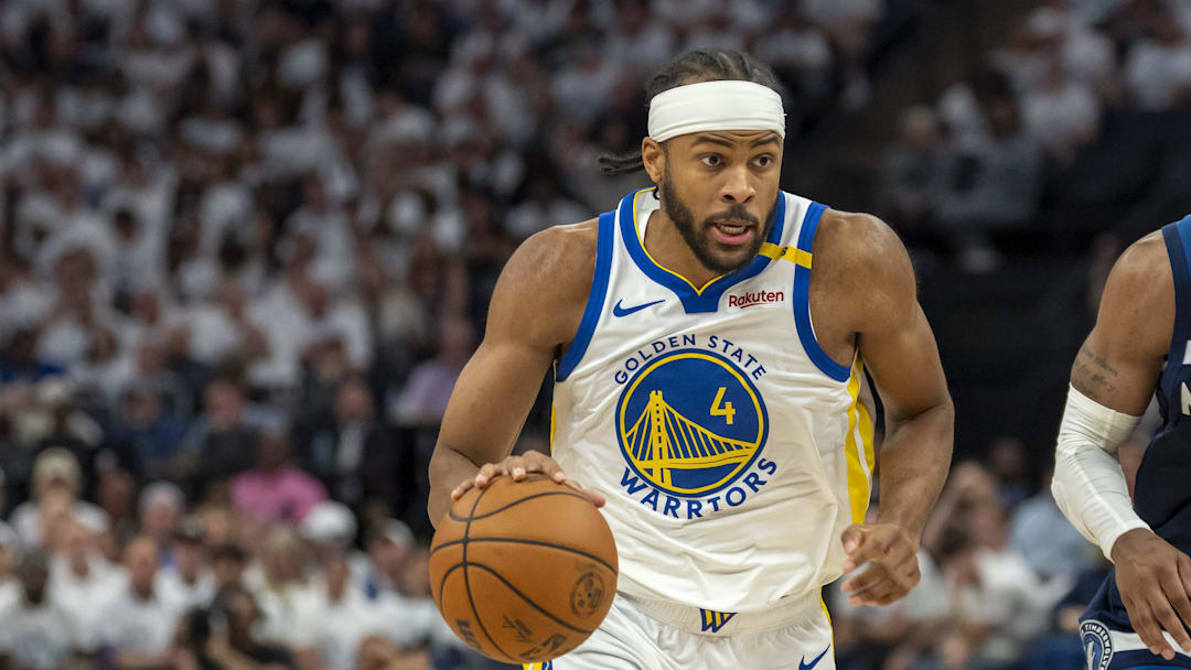 May 14, 2025; Minneapolis, Minnesota, USA; Golden State Warriors guard Moses Moody (4) drives to the basket past Minnesota Timberwolves guard Mike Conley (10) in the second half during game five of the second round for the 2025 NBA Playoffs at Target Center. Mandatory Credit: Jesse Johnson-Imagn Images