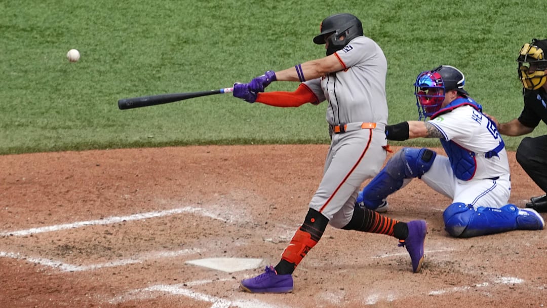 Jul 19, 2025; Toronto, Ontario, CAN; San Francisco Giants shortstop Willy Adames (2) hits his second home run of the game against the Toronto Blue Jays during the seventh inning at Rogers Centre. 