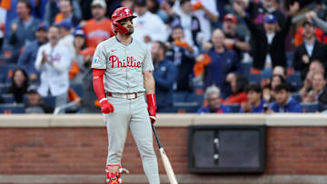 Bryce Harper stands frustrated after an at-bat against the Mets