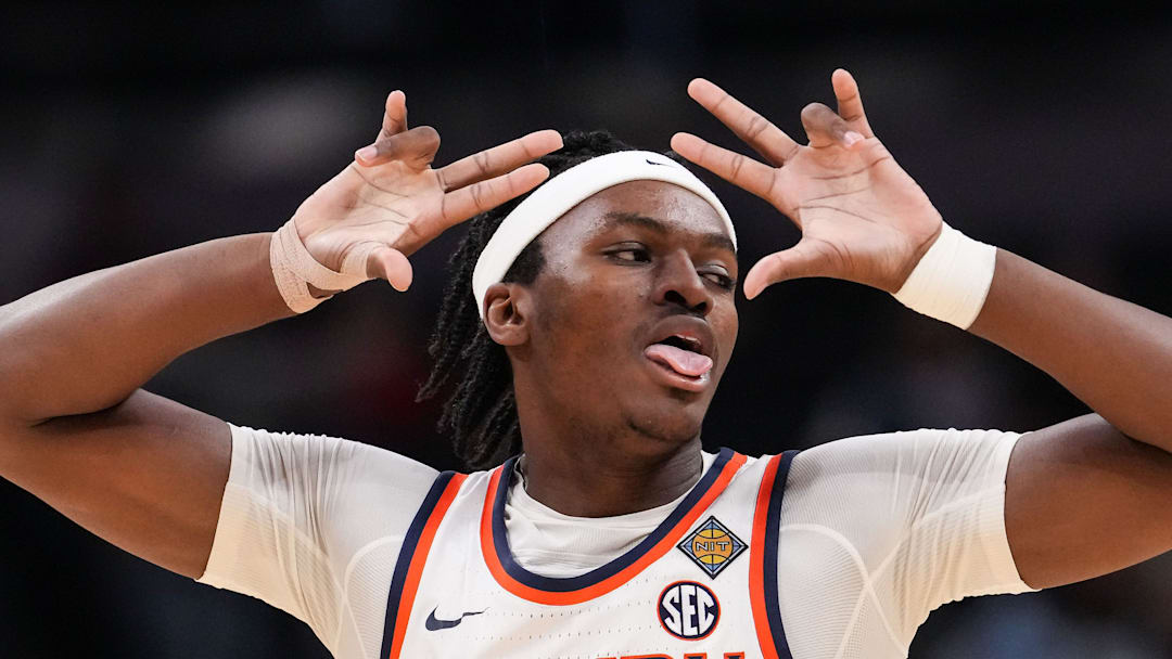 Auburn Tigers forward Sebastian Williams-Adams (33) celebrates a three-point basket Sunday, April 5, 2026, during the NIT men's basketball championship game at Gainbridge Fieldhouse in Indianapolis.