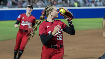 May 29, 2025; Oklahoma City, OK, USA;  Texas Tech Red Raiders utility Bailey Lindemuth (55) makes a catch in foul territory in the sixth inning against the Ole Miss Rebels during the NCAA Softball Women's College World Series at Devon Park. Mandatory Credit: Brett Rojo-Imagn Images