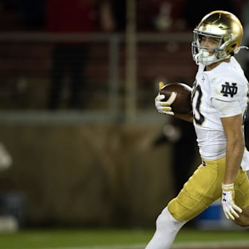 Nov 25, 2023; Stanford, California, USA; Notre Dame Fighting Irish wide receiver Jordan Faison (80) runs in his touchdown reception against the Stanford Cardinal during the third quarter at Stanford Stadium. Mandatory Credit: D. Ross Cameron-Imagn Images