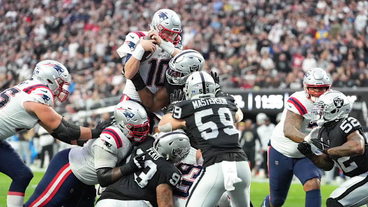 Dec 18, 2022; Paradise, Nevada, USA; New England Patriots quarterback Mac Jones (10) is stopped on the goal line by the Las Vegas Raiders defense during the first half at Allegiant Stadium. Mandatory Credit: Stephen R. Sylvanie-Imagn Images