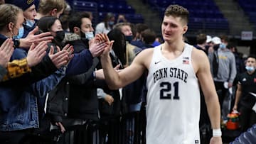 Penn State men's basketball player John Harrar greets fans after a Nittany Lions victory at the Bryce Jordan Center. 