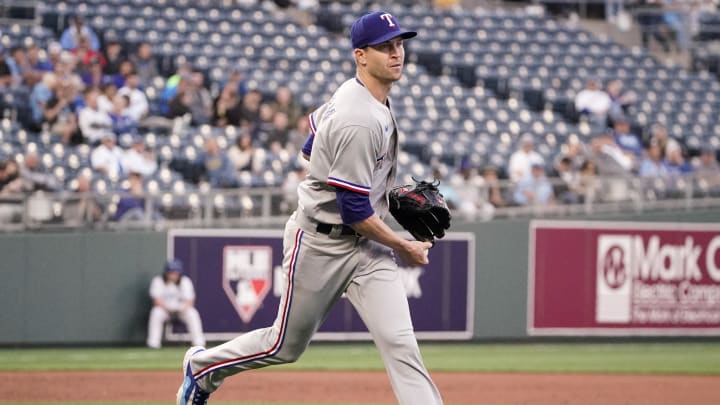 Apr 17, 2023; Kansas City, Missouri, USA; Texas Rangers starting pitcher Jacob deGrom (48) fields a ground ball and throws to first base against the Kansas City Royals during the fourth inning at Kauffman Stadium. Mandatory Credit: Denny Medley-USA TODAY Sports