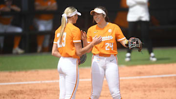Tennessee infielder McKenna Gibson (24) and Tennessee pitcher Karlyn Pickens (23) high-five during a