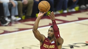 Dec 1, 2024; Cleveland, Ohio, USA; Cleveland Cavaliers guard Donovan Mitchell (45) shoots a free throw in the fourth quarter against the Boston Celtics at Rocket Mortgage FieldHouse. Mandatory Credit: David Richard-Imagn Images
