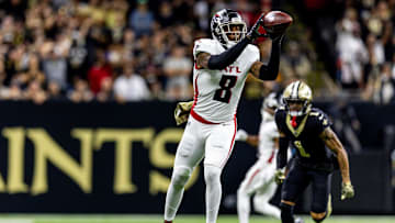 Nov 10, 2024; New Orleans, Louisiana, USA;  Atlanta Falcons tight end Kyle Pitts (8) catches a pass on and stopped by New Orleans Saints cornerback Alontae Taylor (1) on fourth down during the second half at Caesars Superdome. Mandatory Credit: Stephen Lew-Imagn Images
