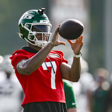 Jul 25, 2025; Florham Park, NJ, USA; New York Jets quarterback Justin Fields (7) catches a ball during a drill at training camp at Atlantic Health Jets Training Center. Mandatory Credit: John Jones-Imagn Images