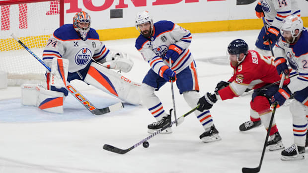 Hockey player clears puck