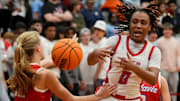 Vestavia Hills guard Grayson Hudgens (12) knocks the ball away from Hillcrest guard Skylynn Latham (0) at Hillcrest High School Tuesday, Dec. 10, 2024. Hillcrest downed Vestavia Hills 71-45.