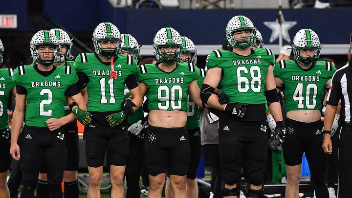 Southlake Carroll's captains walk to mid-field during the 6A DII UIL Texas State Football Championship game against Austin Vandegrift on Saturday, December 21, 2024 at AT&T Stadium in Arlington.