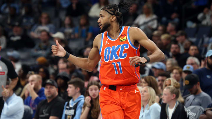 Mar 16, 2024; Memphis, Tennessee, USA; Oklahoma City Thunder guard Isaiah Joe (11) reacts after a three-point basket during the second half against the Memphis Grizzlies at FedExForum. Mandatory Credit: Petre Thomas-USA TODAY Sports