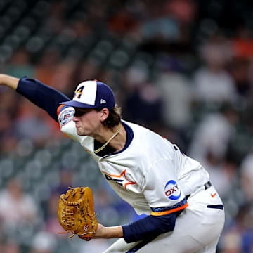 Apr 21, 2025; Houston, Texas, USA; Houston Astros relief pitcher Forrest Whitley (55) delivers a pitch against the Toronto Blue Jays during the ninth inning at Daikin Park. 