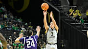 Feb 11, 2025; Eugene, Oregon, USA; Oregon Ducks guard Jackson Shelstad (3) scores a three-point basket against the Northwestern Wildcats during the second half at Matthew Knight Arena. Mandatory Credit: Craig Strobeck-Imagn Images