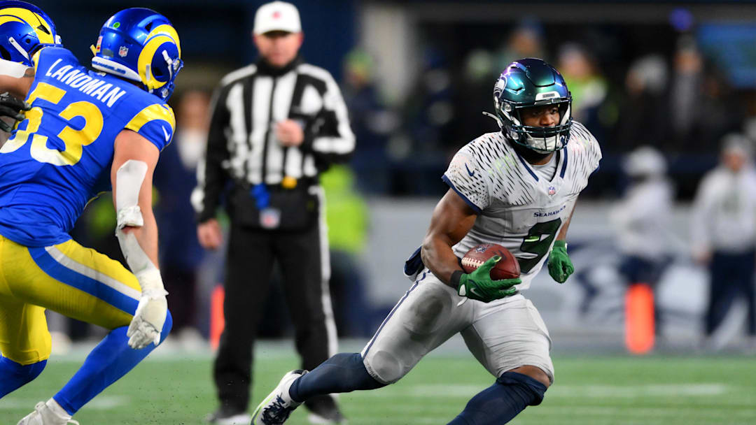 Dec 18, 2025; Seattle, Washington, USA; Seattle Seahawks running back Kenneth Walker III (9) runs against the Los Angeles Rams in overtime at Lumen Field. Mandatory Credit: Steven Bisig-Imagn Images Dec 18, 2025; Seattle, Washington, USA; Seattle Seahawks running back Kenneth Walker III (9) runs against the Los Angeles Rams in overtime at Lumen Field. Mandatory Credit: Steven Bisig-Imagn Images