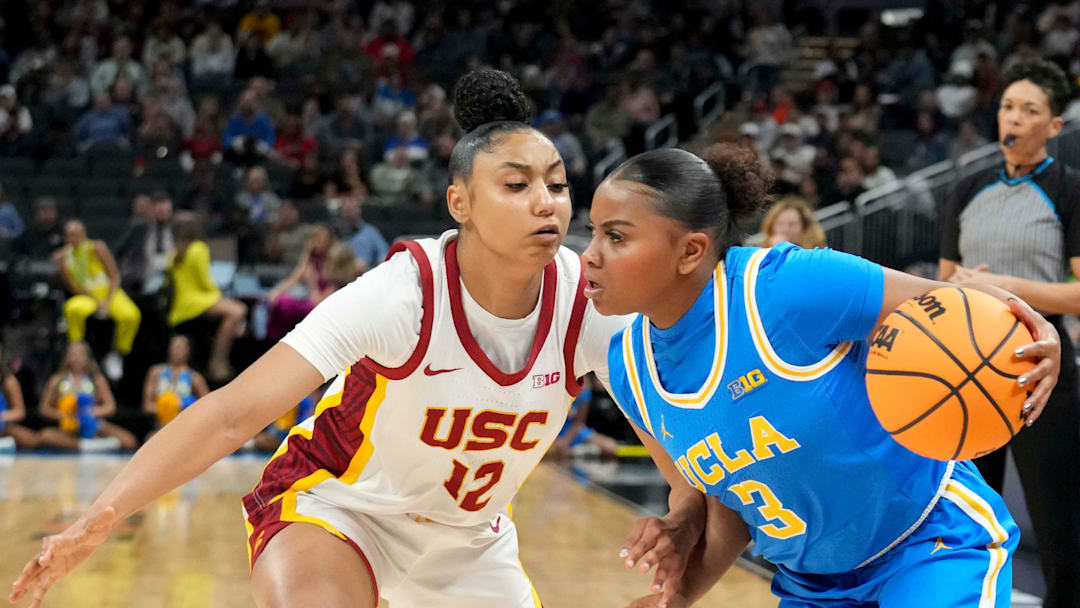 USC Trojans guard JuJu Watkins (12) guards UCLA Bruins guard Londynn Jones (3) during the first half of the 2025 TIAA Big Ten Women's Basketball Tournament final game on Sunday, March 9, 2025, at Gainbridge Fieldhouse in Indianapolis. UCLA defeated USC 72-67.