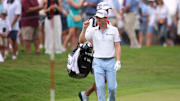 Justin Thomas reacts after making a shot on the first hole during the first round of the TOUR Championship golf tournament