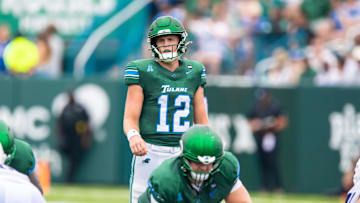 Aug 30, 2025; New Orleans, Louisiana, USA; (Editors Notes:
Caption Correction) Tulane Green Wave quarterback Jake Ratzlaff (12) calls for the ball against Northwestern Wildcats during the first half at Yulman Stadium. Mandatory Credit: Stephen Lew-Imagn Images
