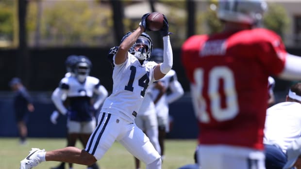  Dallas Cowboys wide receiver Cam Johnson (14) makes a catch during training camp at the River Ridge Playing Fields in Oxnard