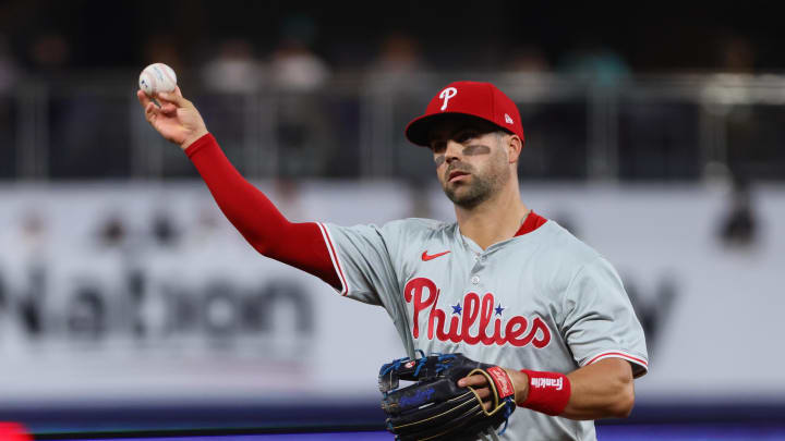 Philadelphia Phillies second baseman Whit Merrifield (9) throws to first base to retire Miami Marlins center fielder Jazz Chisholm Jr. (not pictured) during the second inning at loanDepot Park on May 10.