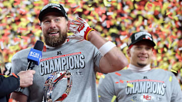 Jan 26, 2025; Kansas City, MO, USA; Kansas City Chiefs tight end Travis Kelce (87) reacts on stage after the AFC Championship game against the Buffalo Bills at GEHA Field at Arrowhead Stadium. Mandatory Credit: Mark J. Rebilas-Imagn Images