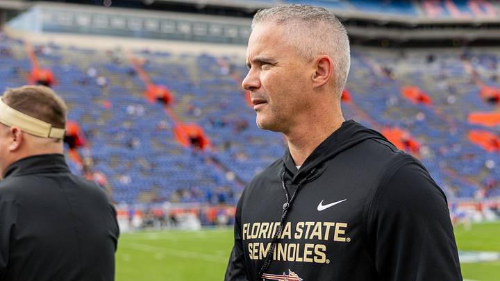Nov 29, 2025; Gainesville, Florida, USA; Florida State Seminoles head coach Mike Norvell walks the sidelines before a game against the Florida Gators at Ben Hill Griffin Stadium. Mandatory Credit: Bob Kupbens-Imagn Images
