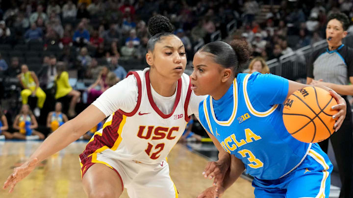 USC Trojans guard JuJu Watkins (12) guards UCLA Bruins guard Londynn Jones (3) during the first half of the 2025 TIAA Big Ten Women's Basketball Tournament final game on Sunday, March 9, 2025, at Gainbridge Fieldhouse in Indianapolis. UCLA defeated USC 72-67.