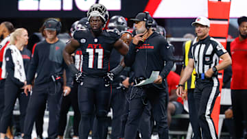 Atlanta Falcons defensive coordinator Jeff Ulbrich and linebacker Jalon Walker