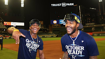 Sep 27, 2024; Atlanta, Georgia, USA; Kansas City Royals outfielder Dairon Blanco (44) and third baseman Maikel Garcia (11) celebrates after clinching a wild card playoff birth after a game against the Atlanta Braves at Truist Park. Mandatory Credit: Brett Davis-Imagn Images