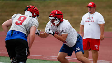Nixa High School freshman Jackson Cantwell (right) runs drills during football practice on Tuesday, July 12, 2022. Cantwell is 6-foot-8 and a multi-sport athlete and also scored a 33 on the ACT.

Tnixa Football00048